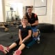 personal trainer massaging woman