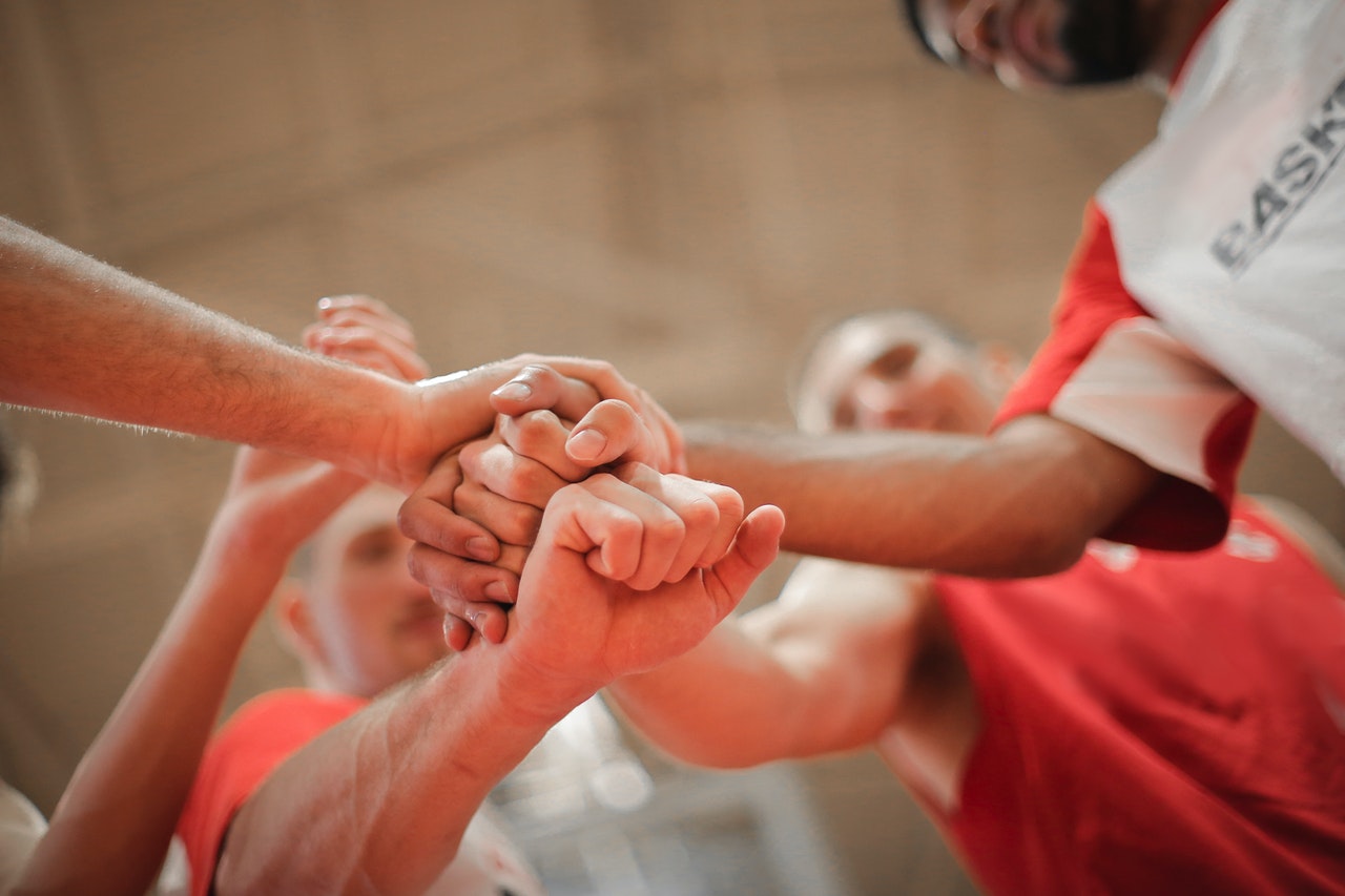 hands together in a pile for team work