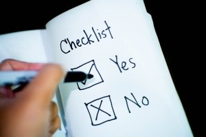 checklist with a black marker choosing yes