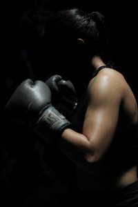 woman with muscles and gloves
