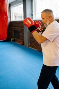man ready to punch a punching bag
