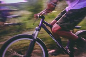 blurred image of cyclist in motion