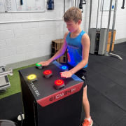 young teen using blaze pods on a box