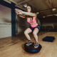woman balancing on a bosu ball