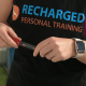 woman in recharged personal training singlet using insulin pen.