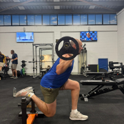 man doing split squat in private gym