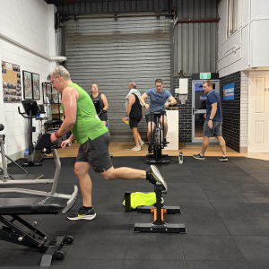 people in a small studio getting personal training